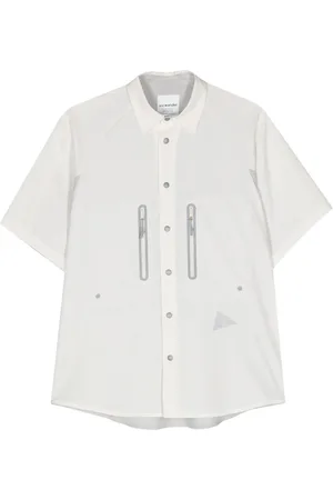 and wander Camisa manga corta con detalles rasgados