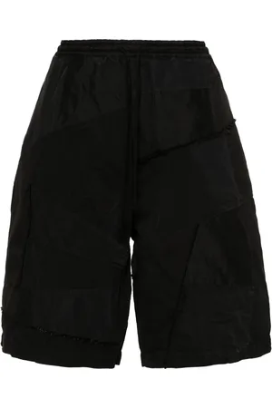 Comme des Garçons Shorts con paneles y detalles rasgados
