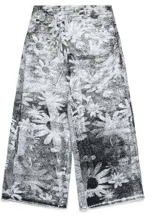 Maison Margiela Jeans anchos con estampado floral