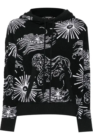 CHANEL Hoodie con león bordado y cierre