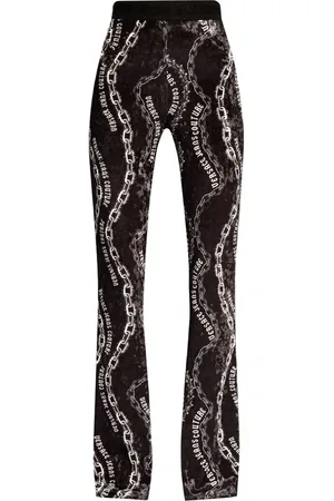 VERSACE Pantalones acampanados con estampado de cadena