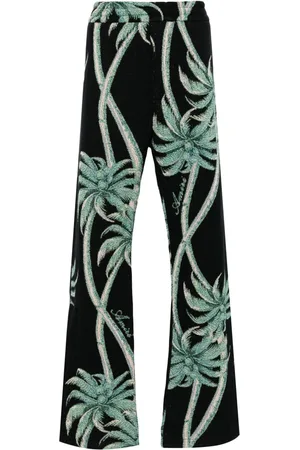 AMIRI Pantalones tejidos con palmeras estampadas