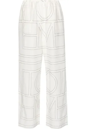 Totême Pantalones con monograma bordado