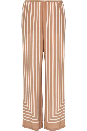 Totême Pantalones palazzo de seda con estampado geométrico