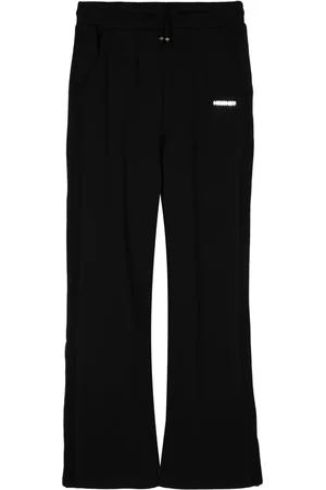 Musium Div. Pants con parche del logo y cordones en la pretina