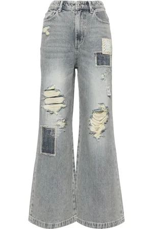 Musium Div. Jeans con detalles rasgados