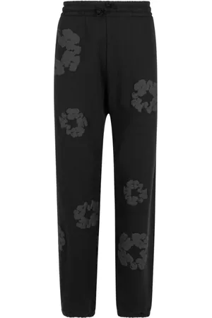 DENIM TEARS Pants con estampado Cotton Wreath