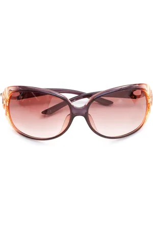 Dior Lentes de sol con armazón ovalada y placa del logo