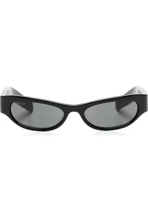 Gucci Lentes de sol con armazón cat eye y placa del logo