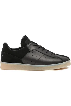 Maison Margiela Tenis con agujetas y suela semitransparente