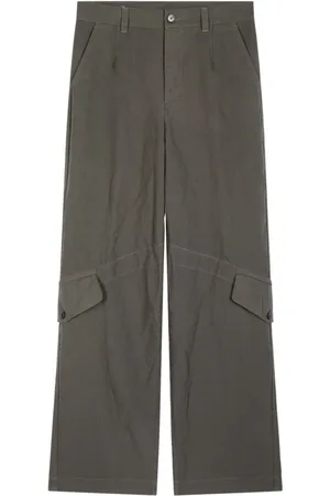 DRIES VAN NOTEN Pantalones con bolsillos y solapa