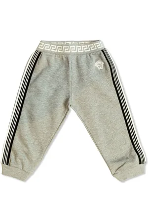 VERSACE Pants con logo estampado