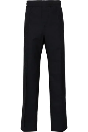Gucci Pantalones rectos con motivo GG Supreme