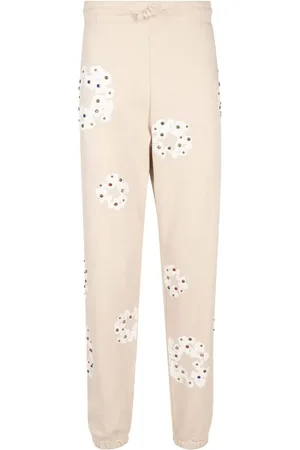 DENIM TEARS Pants con estampado de guirnalda y detalles de strass