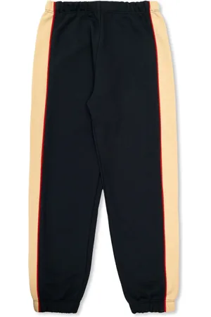 VERSACE Pantalones con logo bordado