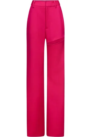 AREA Pantalones asimétricos con abertura