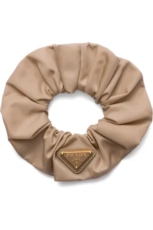 Prada Dona Re-Nylon con logo triangular