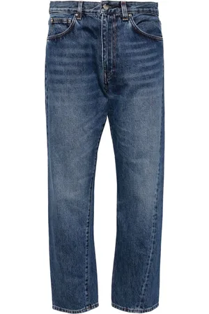 Totême Jeans con costuras retorcidas