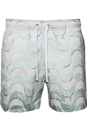 AMIRI Shorts de playa con estampado gráfico
