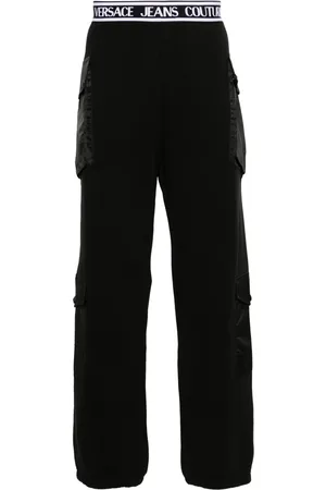 VERSACE Pants con logo en la pretina