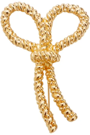Dior Broche bañado en oro con moño
