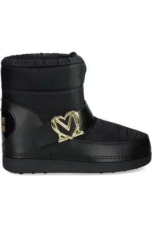 Moschino Botas capitonadas con placa del logo