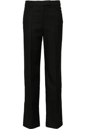 REMAIN Pantalones slim
