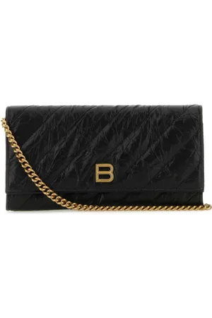 Balenciaga Cartera capitonada con placa del logo