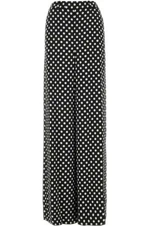 Saint Laurent Pantalones de seda con estampado de lunares