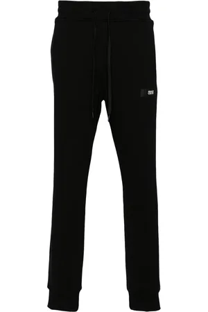 VERSACE Pants con parche del logo