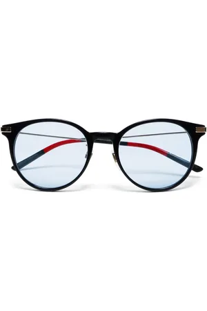 Gucci Lentes de sol con armazón redonda y micas oscuras