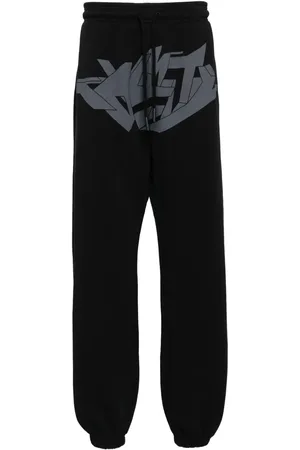 MARCELO BURLON Pants con estampado gráfico