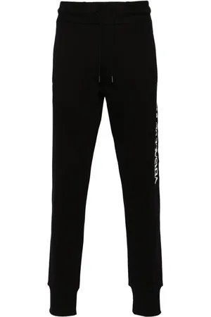 VERSACE Pants con parche del logo