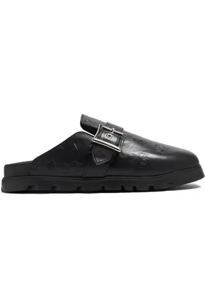 MCM Mules con monograma