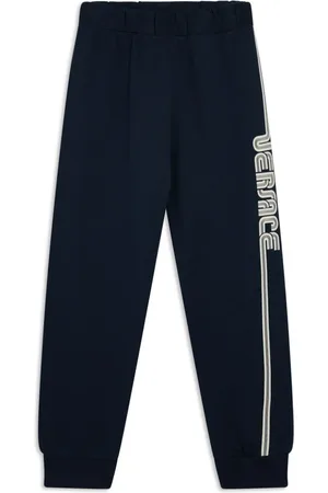 VERSACE Pantalones con logo estampado