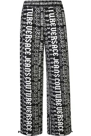 VERSACE Pants con logo estampado