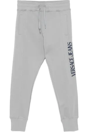 VERSACE Pants con logo estampado