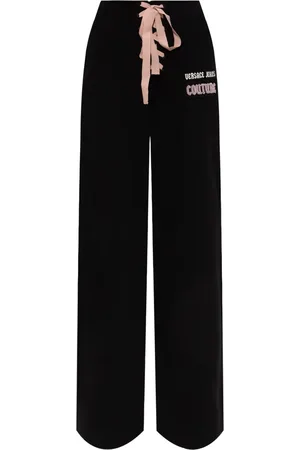 VERSACE Pants con logo estampado