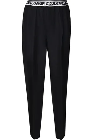 VERSACE Pantalones con logo en la pretina