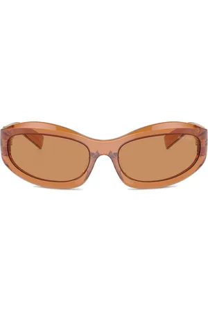 Miu Miu Lentes de sol con transparentes