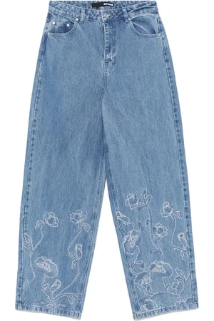 ROTATE Jeans anchos con detalles de strass
