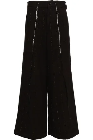 Comme des Garçons Pantalones con efecto envejecido