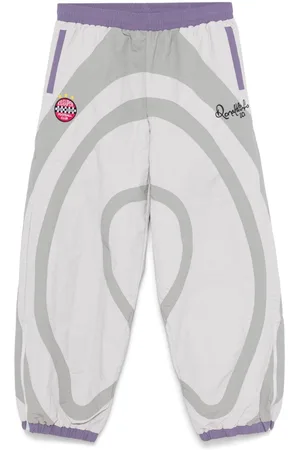 KIDSUPER STUDIOS Pants rompevientos de x Ronaldinho