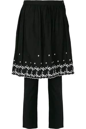 Comme des Garçons Embroidered skirt over trousers