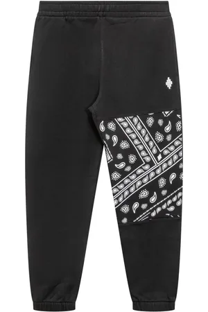 MARCELO BURLON Pants con estampado de bandana