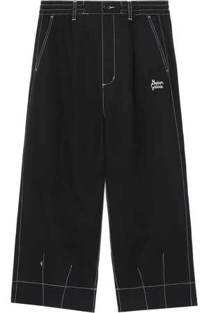 Musium Div. Pantalones chinos con bolsillos y solapa