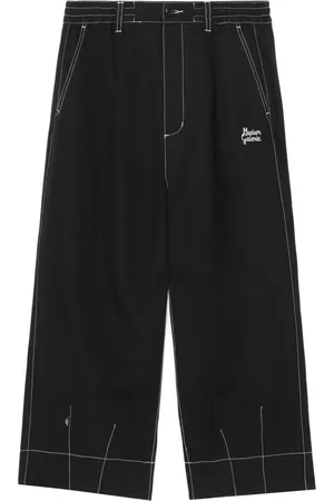 Musium Div. Pantalones chinos con bolsillos y solapa