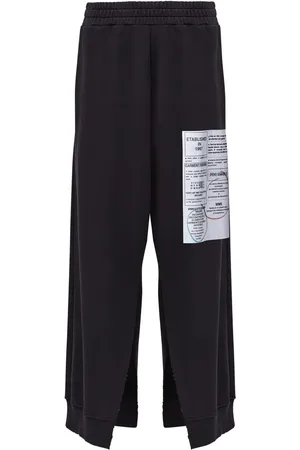 Maison Margiela Pantalones acampanados con motivo de números