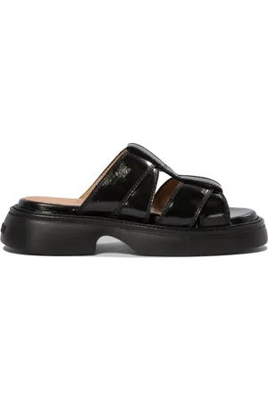 Ganni Mules con diseño enrejado