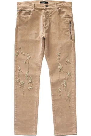 UNDERCOVER Pantalones slim con detalle de mostacillas